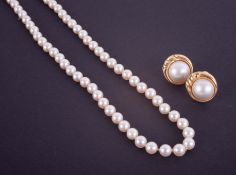 A pair of 9ct pearl earrings set in yellow gold, together with a pearl necklace with a 9ct clasp,