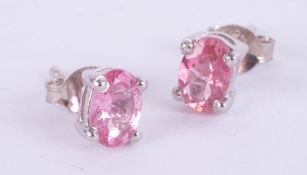 Pair of silver studs set with deep pink tourmaline