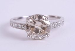 A fine platinum diamond solitaire ring, approximately 2ct, further set with diamonds to the