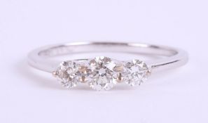 An 18ct white gold and diamond trilogy ring, approx. 0.50ct, estimated colour and clarity D/SI1,