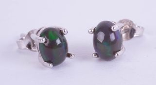 Pair of silver studs set with cabochon black Ethiopian opal
