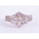 An 18ct diamond cluster ring set in white gold, size J/K.