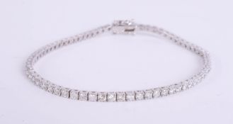 A 18ct diamond set line bracelet, set in white gold, approximately 2.80ct, length 19cm.