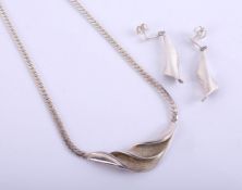 A contemporary silver necklace and matching earrings, stamped 925, box with sticker marked '
