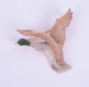 A three colour gold and enamel bird brooch, marked 375, 9, J.G & S, height 30mm.