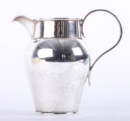 Silver milk jug with plain body and ribbed scroll handle, London, Maker: H.L., Lambert of