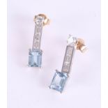 A pair of stylish 18ct aquamarine and diamond set earrings.