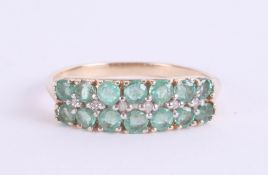 A 9ct emerald and diamond dress ring, size P.
