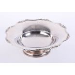 Silver nut dish on rising stem with ribbon and foliate decoration to border, Birmingham, Maker: A