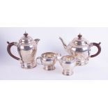 A Geo V silver four piece tea service together with a pair of silver sugar tongs, total weight