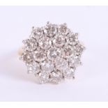 A good 18ct diamond set cluster ring, the head 17mm diameter, set in yellow gold, size O.