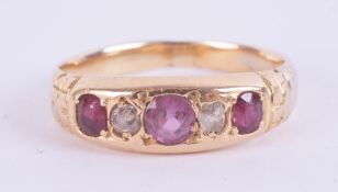 An antique ruby and diamond five stone ring, size O.