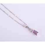An 18ct pink sapphire and diamond pendant, in white gold.