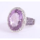 An impressive 18ct white gold amethyst and diamond cluster ring, the head approximately 23mm x