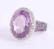 An impressive 18ct white gold amethyst and diamond cluster ring, the head approximately 23mm x