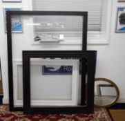 Three picture frames, two black, one white, the largest reveal 124cm x 92cm and a gilt