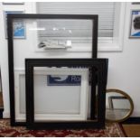 Three picture frames, two black, one white, the largest reveal 124cm x 92cm and a gilt