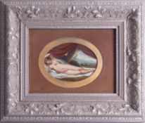 A 19th century oil on card 'Study of a reclining nude' in an oval mount and later frame,
