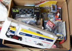 A collection of various scale models including Corgi Toys, F1 Onyx collection, some loose models