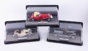 A collection of three Franklin Mint scale models including 1907 Rolls Royce Silver Ghost in