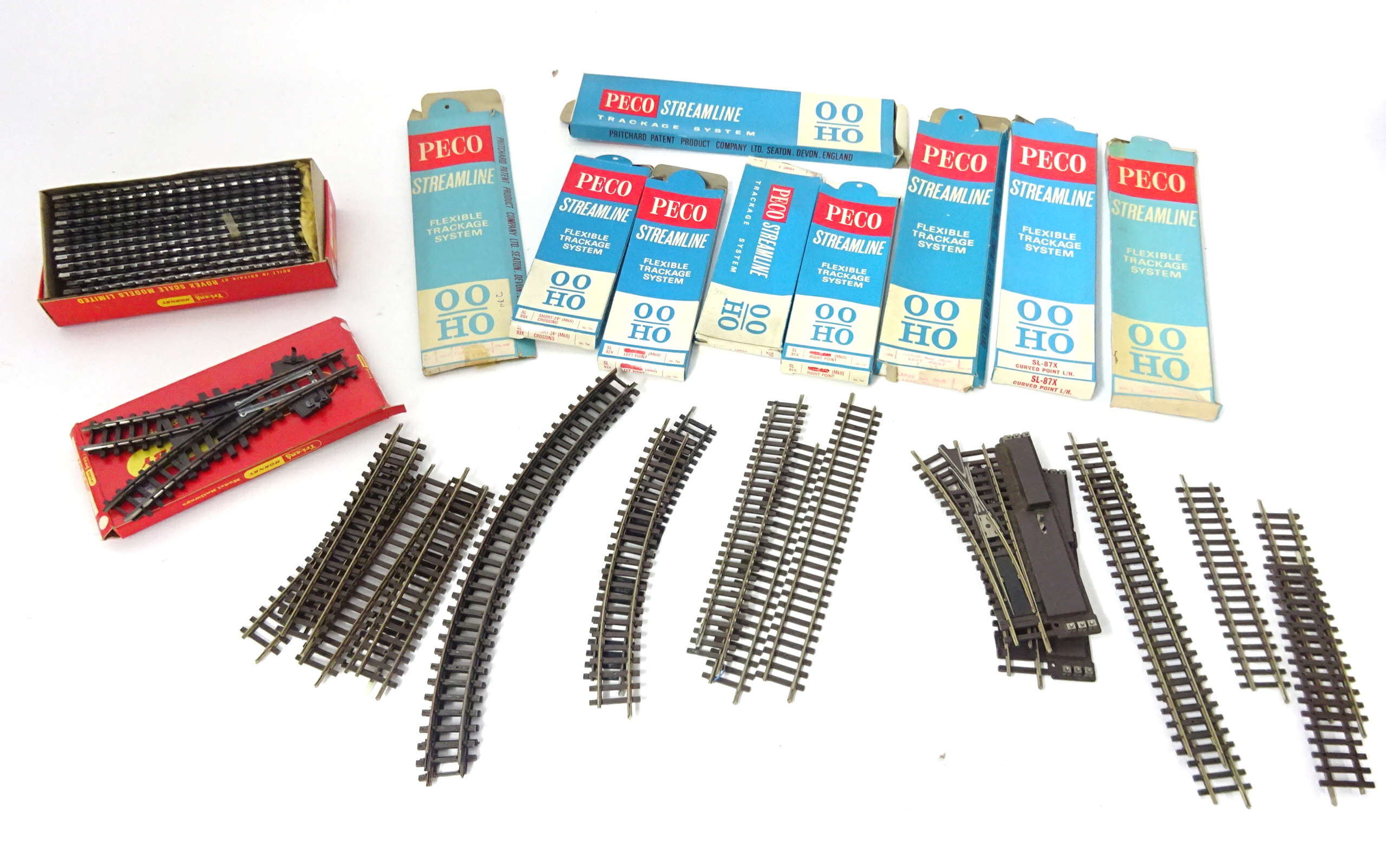A collection of OO Gauge track, Peco track systems, boxed, Triang railway track components, boxed,