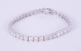 A fine diamond line bracelet set with 41 diamonds in 18ct white gold, total diamond weight