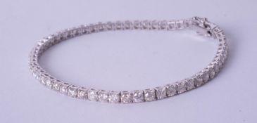 A fine diamond line bracelet set in 18ct white gold, approximately 5.50ct total diamond weight,