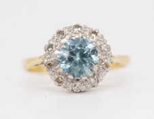 An 18ct blue zircon and diamond set cluster ring, size N.