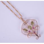 A peridot pendant necklace on fine chain.