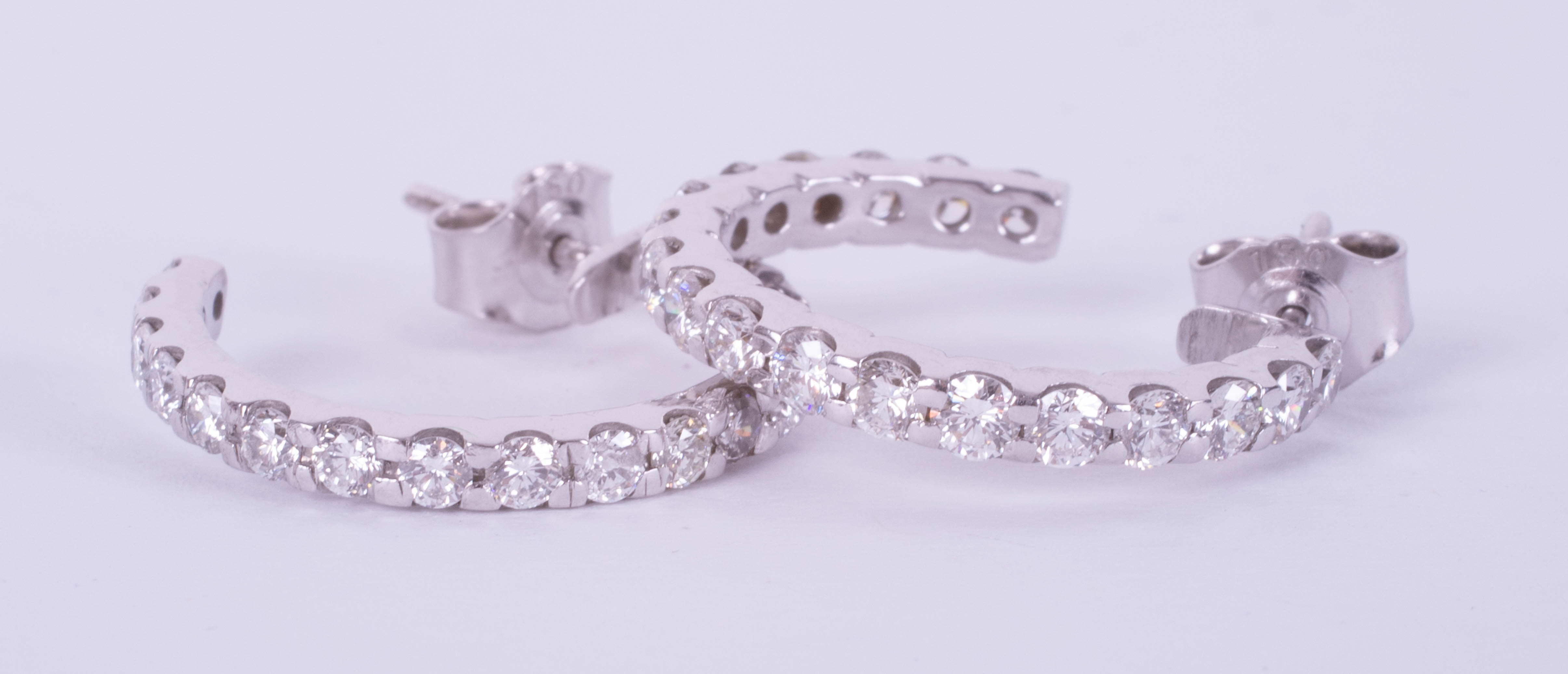 A good pair of diamond set hoop earrings in 18ct white gold.