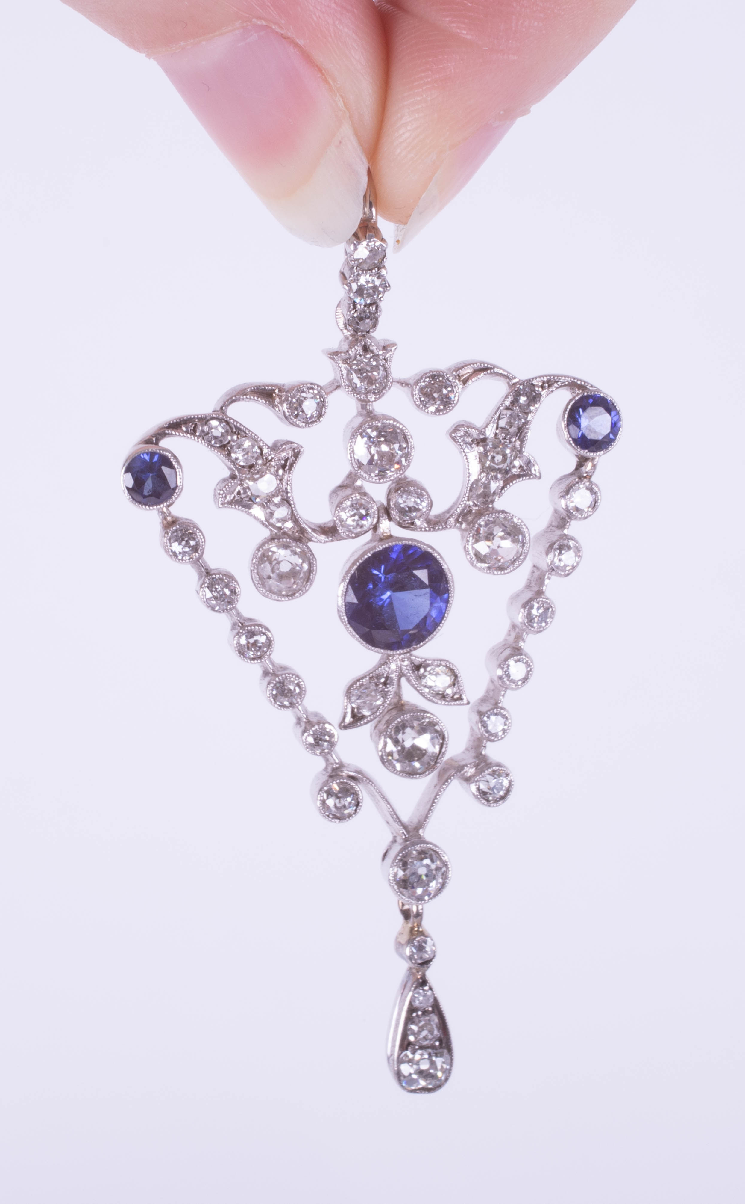 A fine diamond pendant, set with blue stones, overall length 59mm. - Image 2 of 2