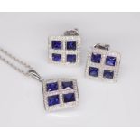 An 18ct sapphire and diamond pendant together with a pair of matching earrings.