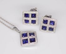 An 18ct sapphire and diamond pendant together with a pair of matching earrings.