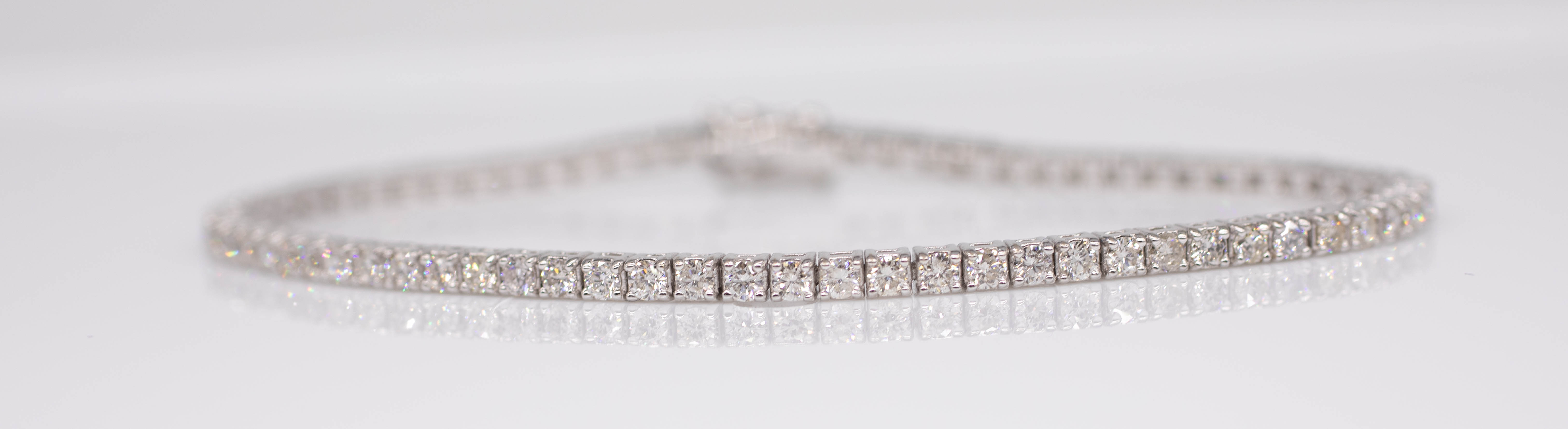 A diamond line bracelet set in 18ct white gold, diamond weight approximately 3 carats, length 18.