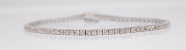 A diamond line bracelet set in 18ct white gold, diamond weight approximately 3 carats, length 18.