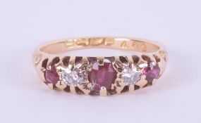 An 18ct ruby and diamond five stone ring, size K.