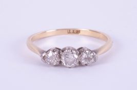 An 18ct diamond three stone ring, approximately 0.40ct, size L.