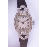 An 18ct gold and platinum diamond set ladies wristwatch.