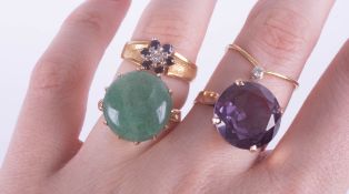 A large amethyst ring, set in gold? indistinct marks, size K, a jade set dress ring, size K, a small