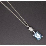 An 18ct aquamarine and diamond set pendant in white gold, on fine chain.