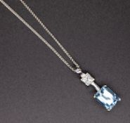 An 18ct aquamarine and diamond set pendant in white gold, on fine chain.