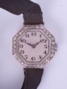 An 18ct vintage and diamond set ladies wristwatch.