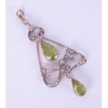 An antique peridot and diamond set pendant, boxed, box marked McDuncan of Glasgow.