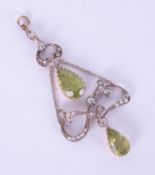 An antique peridot and diamond set pendant, boxed, box marked McDuncan of Glasgow.