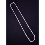 An impressive diamond line necklace, approximate total weight of diamonds 12ct, colour judged to