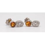 A pair 18ct diamond and fire opal set earrings in white gold.