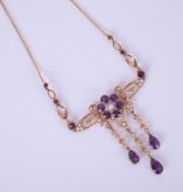 An antique amethyst and pearl set necklace in possibly original box marked 'Kemp Wilcox,