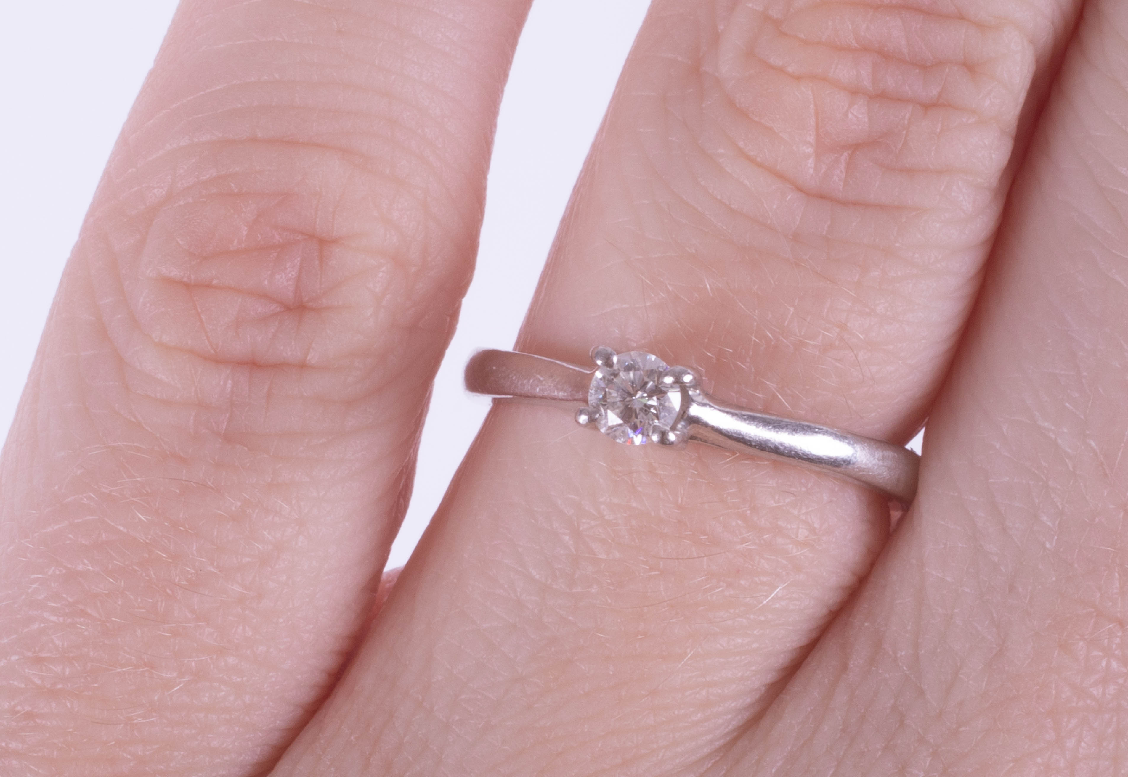 Leo Diamond, a solitaire ring set in platinum with a single diamond, stamped inside the band 0.18 - Image 2 of 5