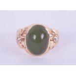 A 14ct jade and diamond set ring in yellow gold, size H.