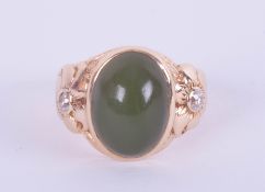 A 14ct jade and diamond set ring in yellow gold, size H.